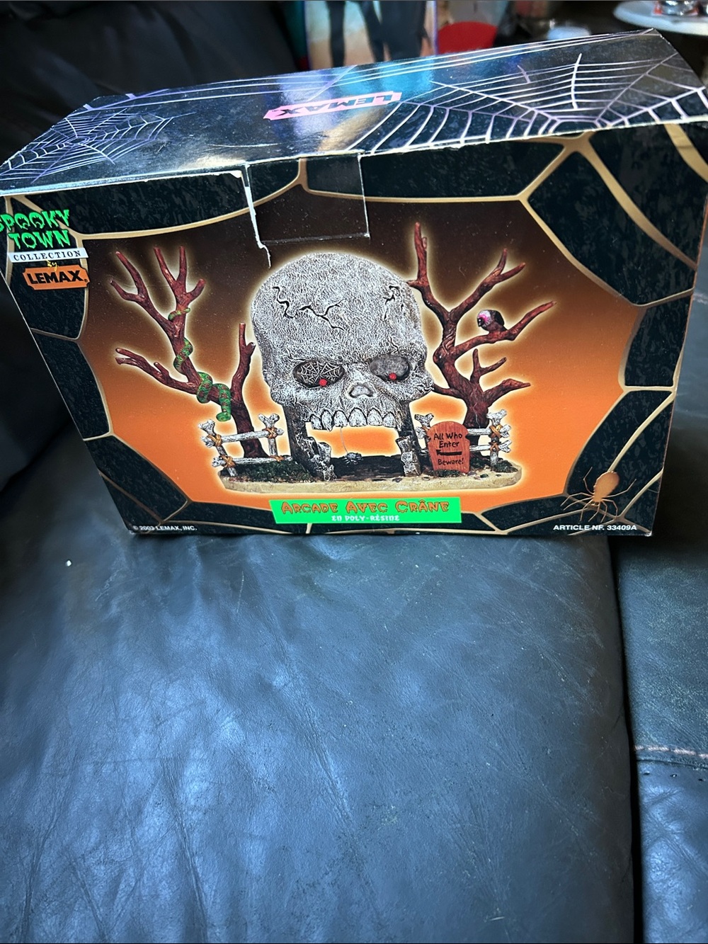 Lemax Halloween Skull Arch in Gray and Brown with Red Accents